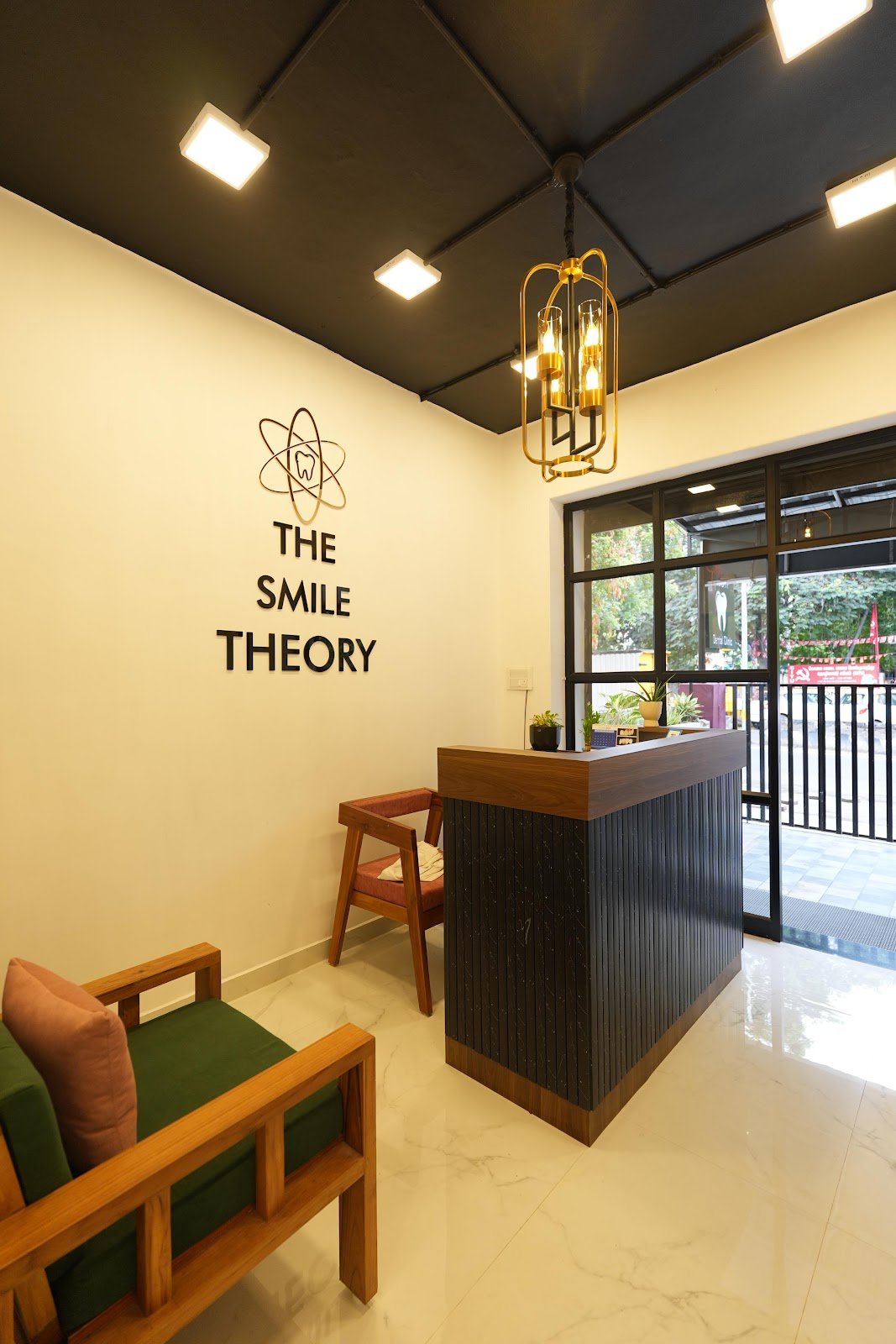 The Smile Theory reception with clinic branding and warm lighting